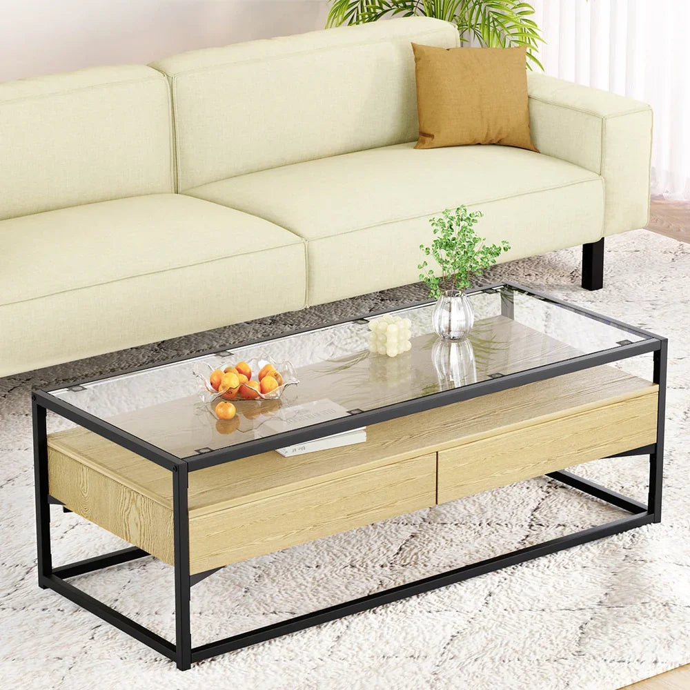Modern glass top coffee table with wood drawers and black metal frame in living room